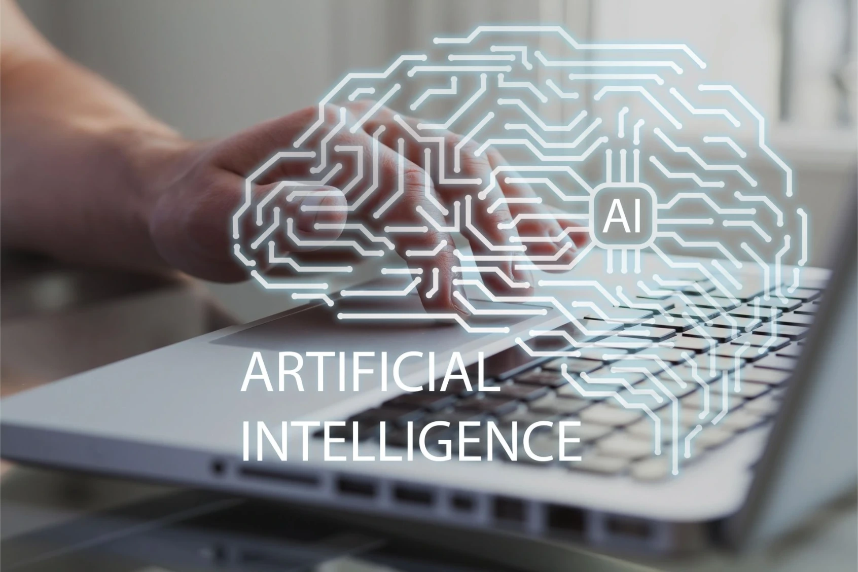 Image photographique avec un effet graphique superposé, en plan rapproché. À l’arrière-plan, on voit un ordinateur portable ouvert, de couleur gris clair. Le clavier occupe la partie inférieure de l’image. Une main humaine (probablement adulte) est posée sur le clavier, doigts légèrement courbés, en train de taper. L’arrière-plan est flou, ce qui met l’accent sur la main et l’ordinateur. Par-dessus la scène réelle est superposé un dessin lumineux semi-transparent, représentant un cerveau stylisé vu de profil. Ce cerveau est composé de lignes blanches et bleu clair, rappelant des circuits électroniques : tracés anguleux, connexions, nœuds, comme un schéma de carte électronique. Au centre du cerveau, un petit pictogramme carré contient les lettres « AI » en blanc, évoquant un microprocesseur ou un cœur de calcul. Sous le cerveau, en grandes lettres capitales blanches, figure le texte : « ARTIFICIAL INTELLIGENCE », centré et bien lisible. L’image associe clairement : l’humain (la main), l’outil (l’ordinateur), et le concept abstrait (l’intelligence artificielle). Le message visuel est explicite : l’intelligence artificielle comme extension technologique de l’activité humaine… avec un cerveau qui ressemble surtout à un circuit imprimé bien rangé, ce qui est déjà beaucoup plus propre que nos vrais cerveaux.